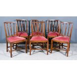 A Set of Six George III Mahogany Dining Chairs with square moulded backs and decoratively carved