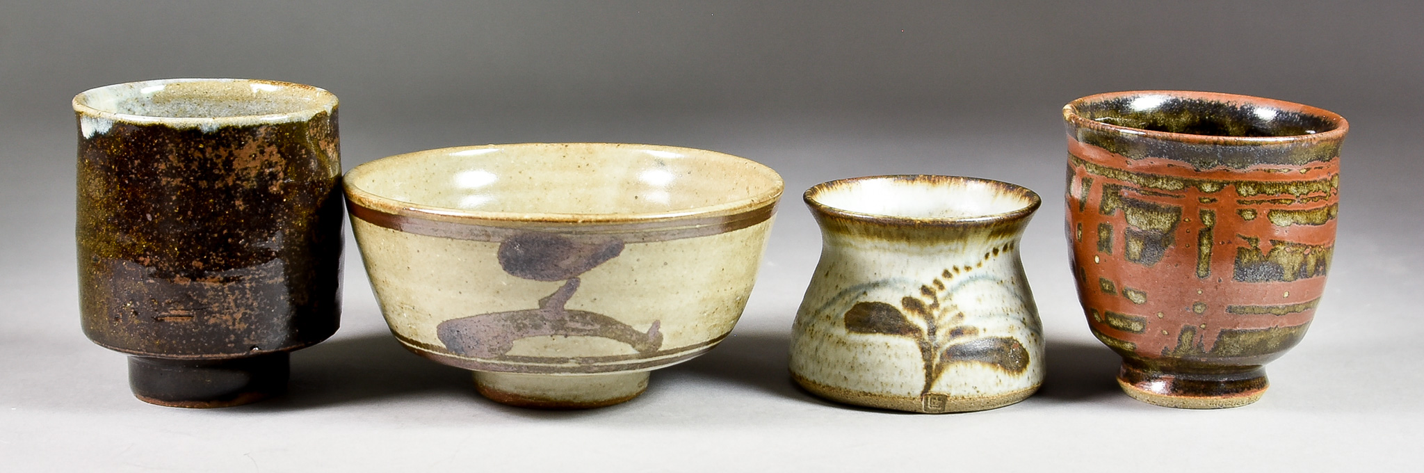 Four Pieces of Stoneware Pottery from the Leach Pottery, 20th Century, comprising - tea bowl