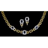 An 18ct Gold Necklace and Earrings Suite, comprising - three row necklace set with brilliant cut