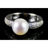 An 18ct Gold Pearl and Diamond Ring, Modern, set with pave diamonds and a central cultured pearl,