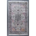 A 20th Century Pure Silk Tabriz Carpet, woven in pastel shades with a bold central floral medallion,