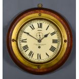 An Early 20th Century Brass Bulkhead Cased Wall Clock, retailed by Lilley & Reynolds Ltd, London E.