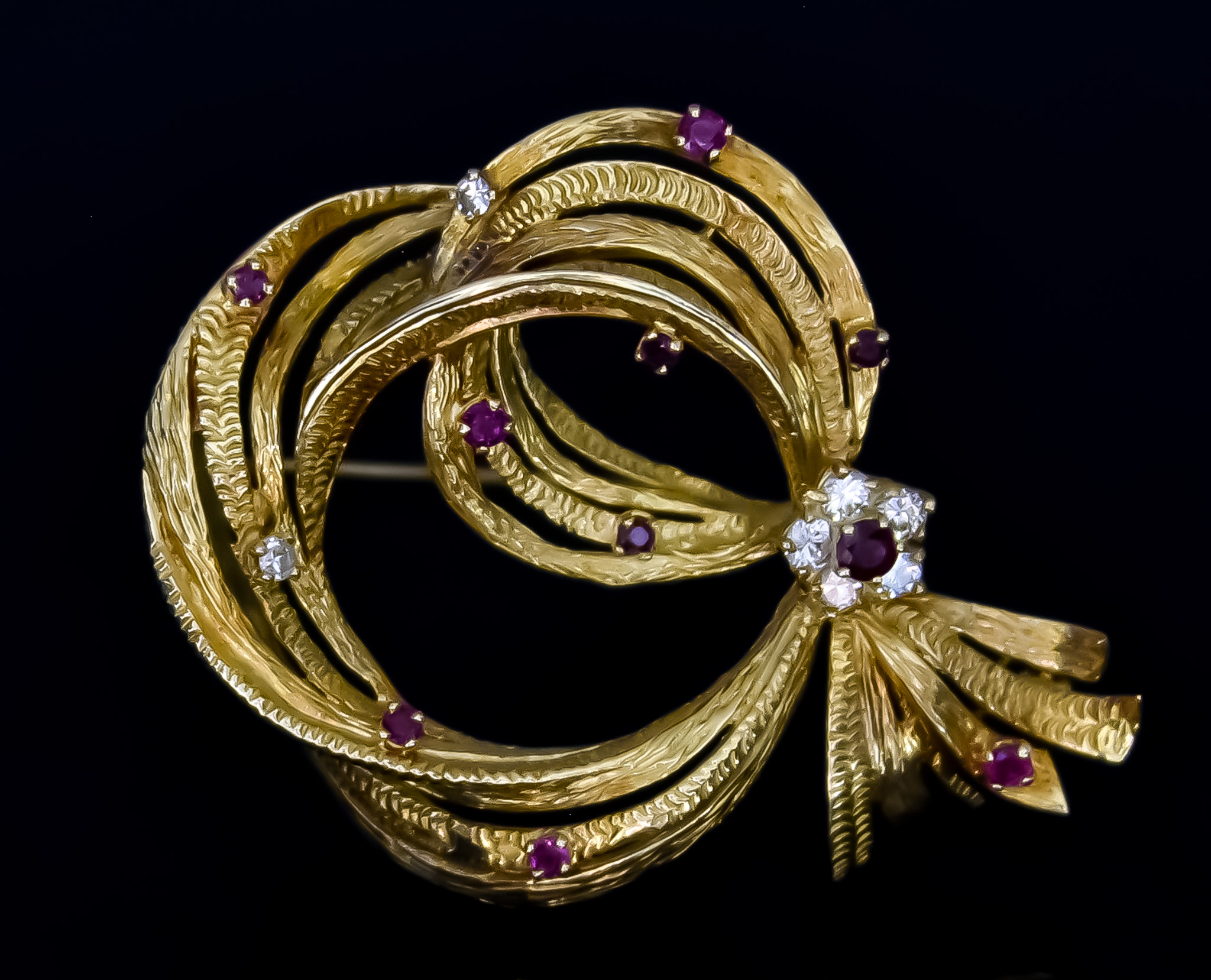 A Diamond and Ruby Brooch, 20th Century, set with small ruby stone and small brilliant cut white