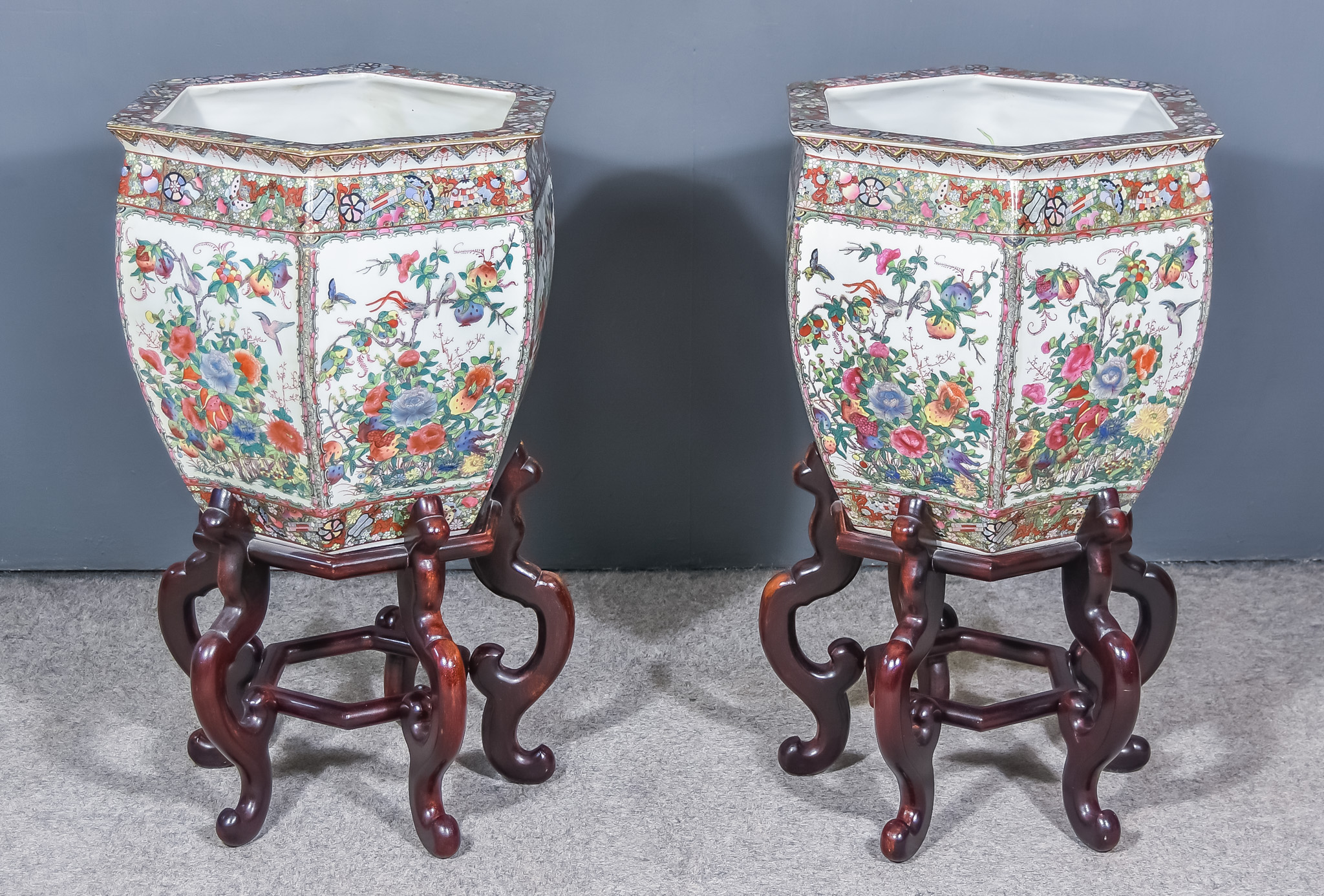 A Pair of Chinese Porcelain Hexagonal Fish Bowls, 20th Century, enamelled in colours with flowers,