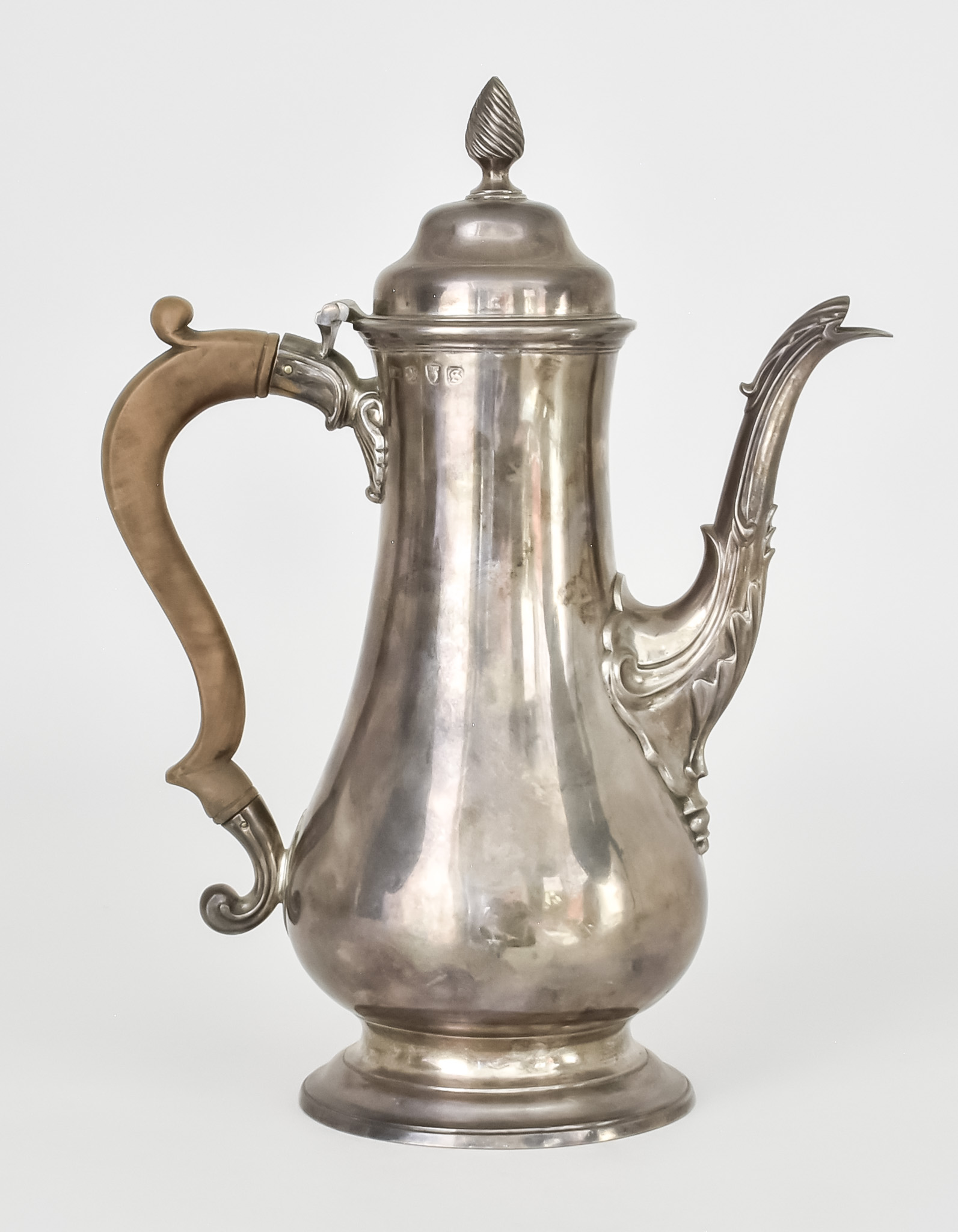 A George III Silver Coffee Pot by W T, London 1773, the shaped cover with reeded finial, plain