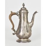 A George III Silver Coffee Pot by W T, London 1773, the shaped cover with reeded finial, plain