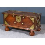 A Dutch East Indies Coffer, with eight large domed brass studs, pierced and engraved covered plates,