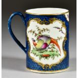 A Worcester Scale Blue Mug, Circa 1768-72, enamelled in colours with exotic birds within shaped