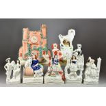 A Staffordshire Pottery Clock Group and Twelve Other Staffordshire Pottery Figures, 19th Century,