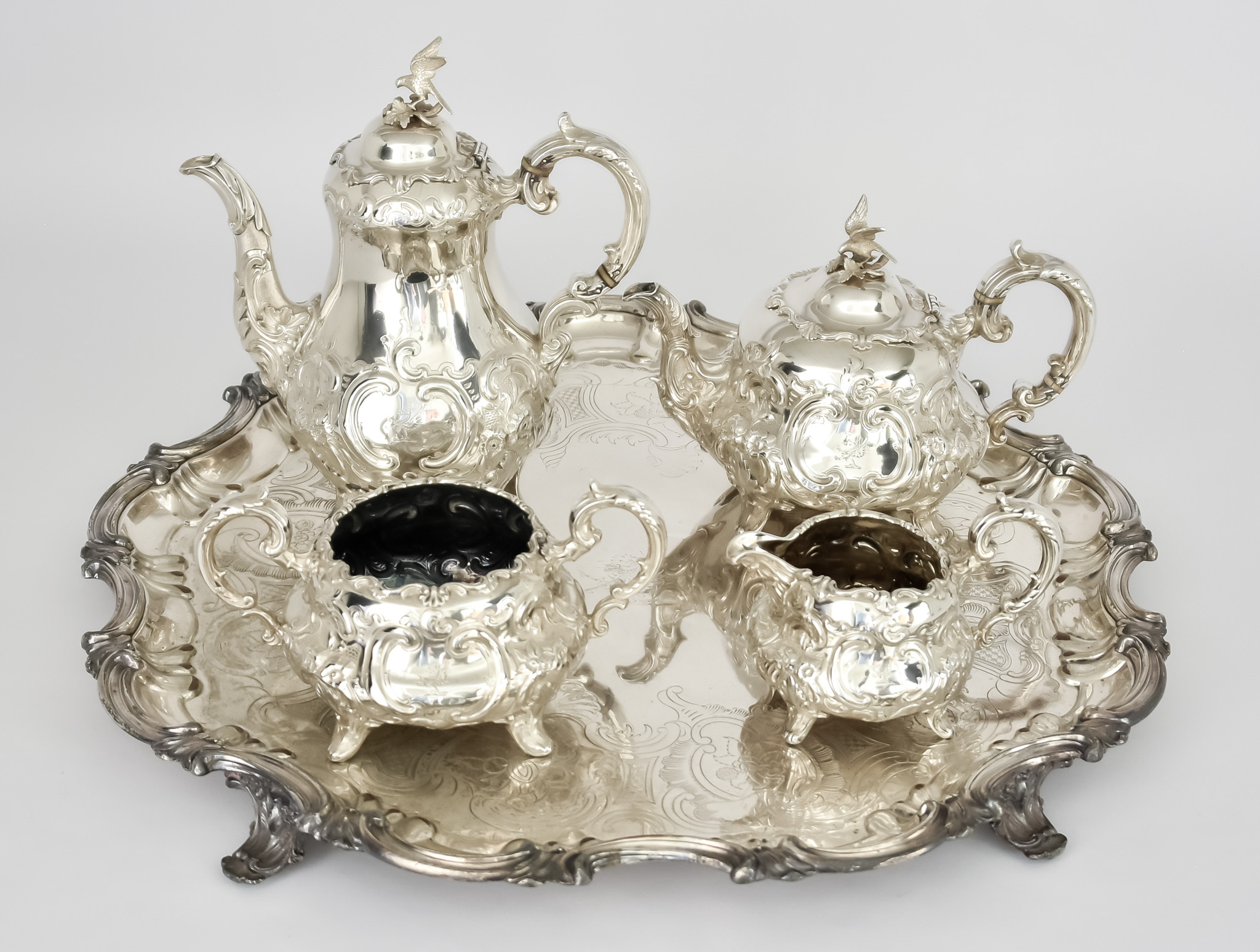 A Victorian Silver Four-Piece Tea and Coffee Service and a Plated Tray, the service by Joseph &