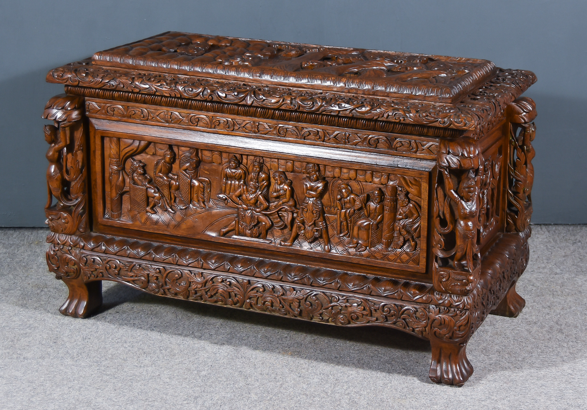 A Modern Near Eastern Indian Hardwood Storage Chest, with raised edge to top, the whole carved