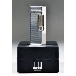 A Modern Dunhill Silvery Coloured Metal Cigarette Lighter, with engine turned designed body, in