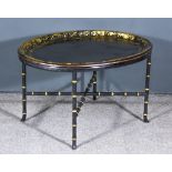 A Black Lacquer and Gilt Decorated Oval Tray decorated with Greek key ornament, on bamboo pattern