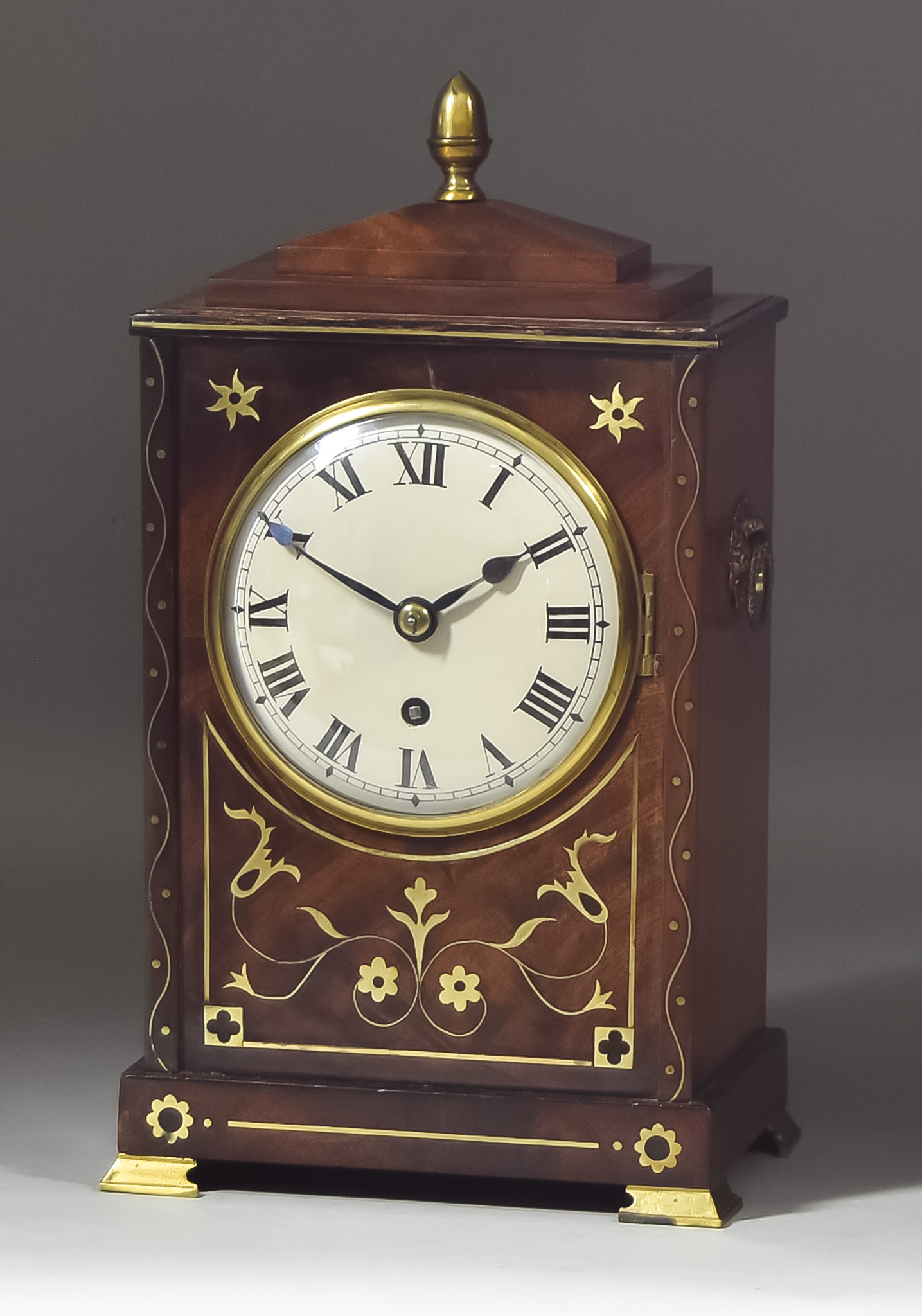 A 19th Century Mahogany Cased Mantel Clock, the 5ins diameter slightly domed dial with Roman