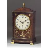A 19th Century Mahogany Cased Mantel Clock, the 5ins diameter slightly domed dial with Roman