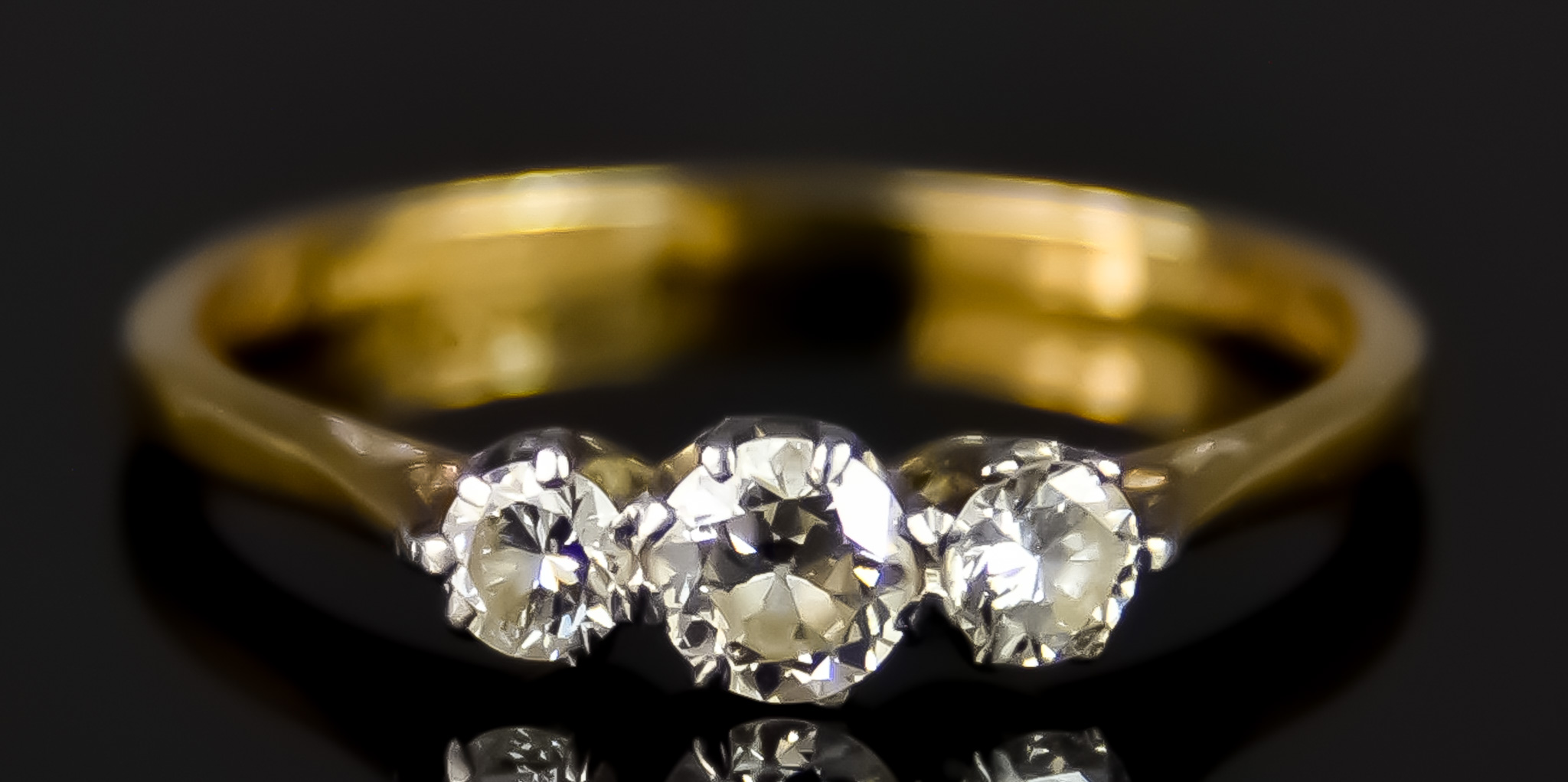An 18ct Gold Three Stone Diamond Ring, 20th Century, set with three small brilliant cut white