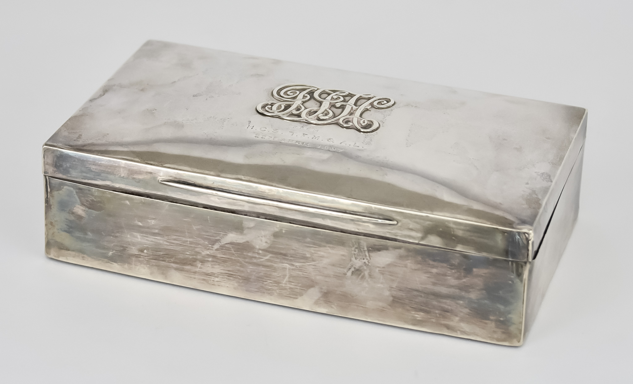 A Late Victorian Silver Rectangular Cigar Box by The Goldsmiths and Silversmiths Co., London 1897,