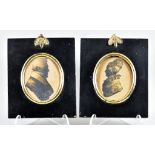 A Pair of English Silhouettes, 19th Century, of a husband and wife, highlighted in gold, 3.25ins x