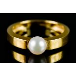 An 18ct Gold Pearl Ring, Modern, set with a cultured pearl, approximately 6mm diameter, size O,