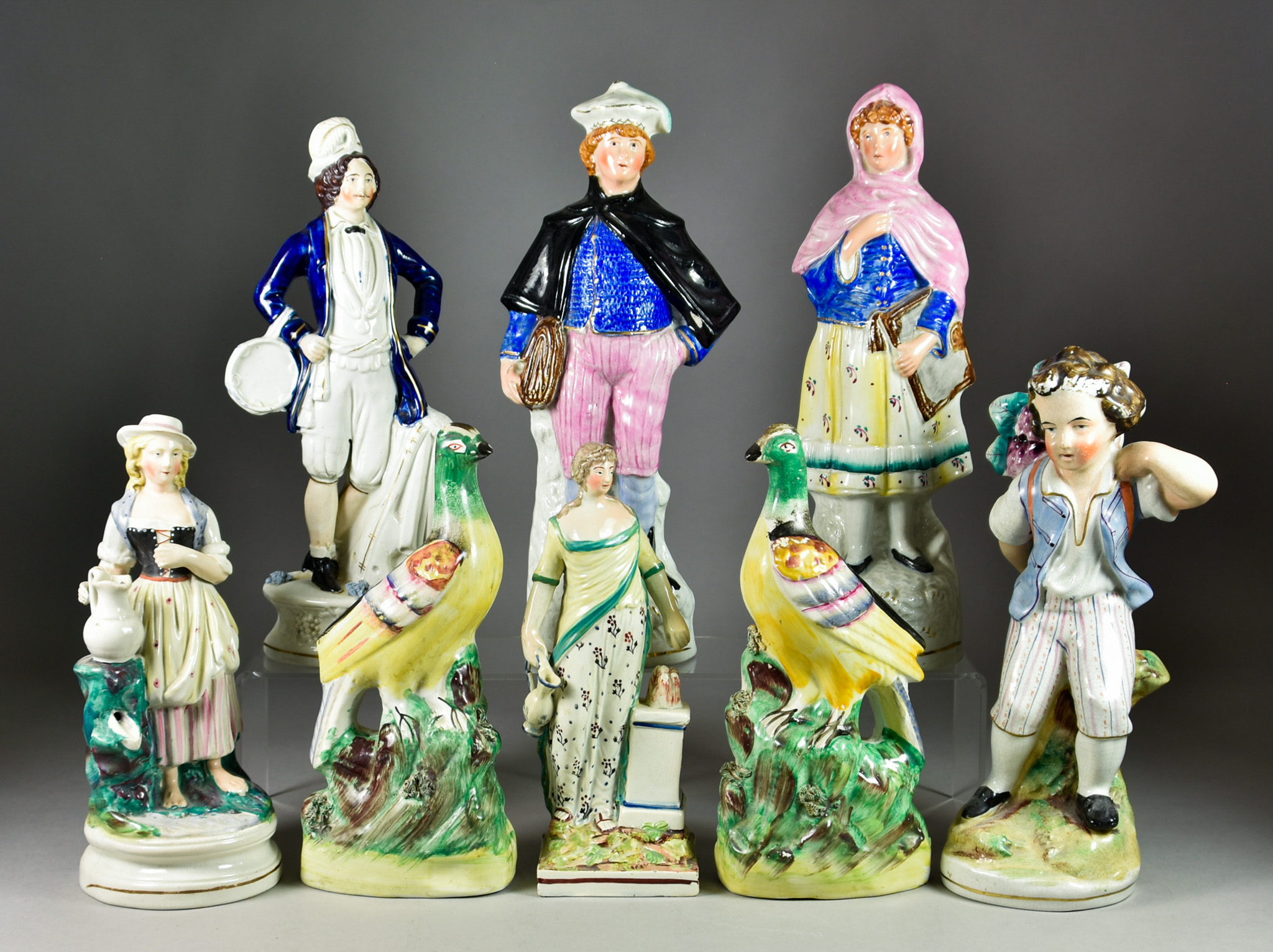 A Staffordshire Pearlware Figure of Hygiea and Seven Staffordshire Pottery Figures, the standing