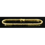 An 18ct Gold Diamond Line Bracelet, Modern, set with brilliant cut white diamonds, approximately