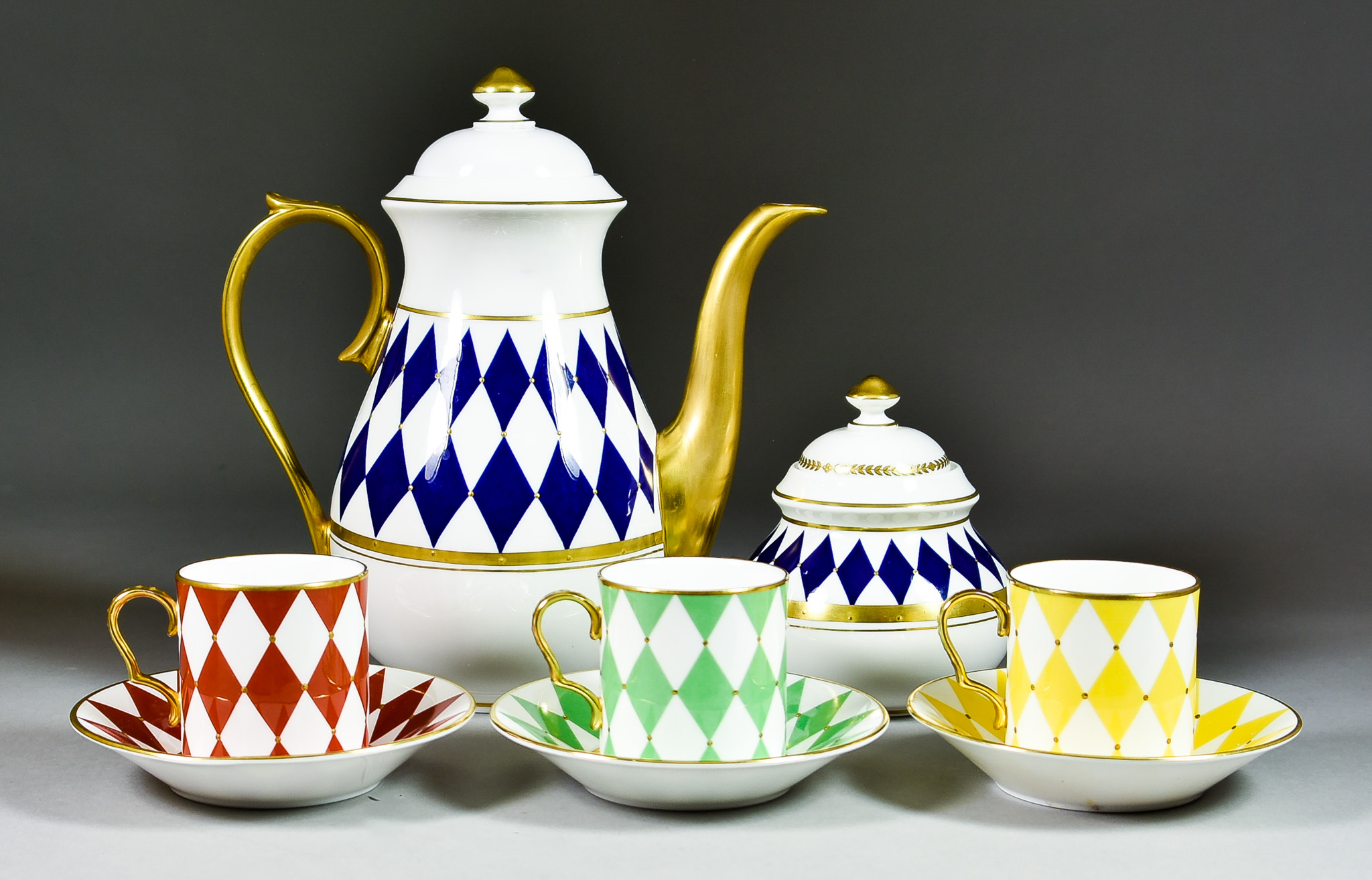A Thomas Goode "Harlequin" Pattern Part Tea Service, with gilt and diamond coloured detail,