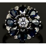 An 18ct Gold Sapphire and Diamond Flower Head Ring, Modern, set with eight pear shaped sapphires,