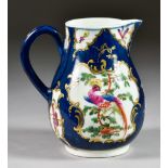 A Worcester Scale Blue Milk Jug, Circa 1768-72, enamelled in colours with exotic birds and