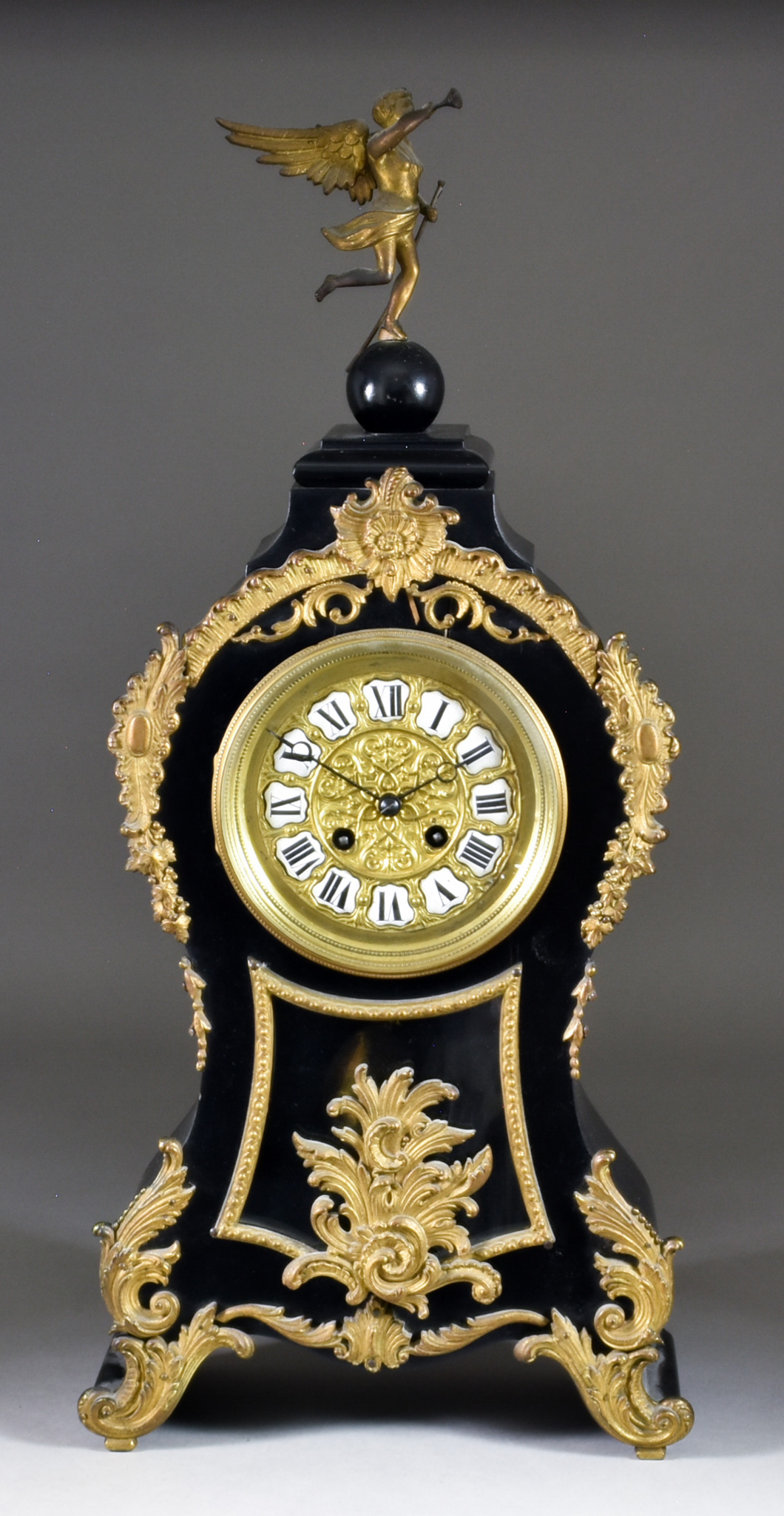 A 19th Century French Ebonised and Gilt Metal Mounted Mantel Clock of 18th Century Design the 4.5ins