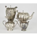 An Elizabeth II Silver Four-Piece Tea Service by William Greenwood & Sons, Birmingham 1955, of melon