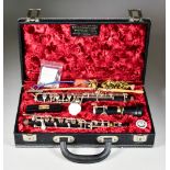 A Ward & Winterbourn Hardwood Oboe No. 1608, with spare reed and grease, cased