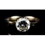 An 18ct Gold Solitaire Diamond Ring, 20th Century, set with a brilliant cut round diamond,