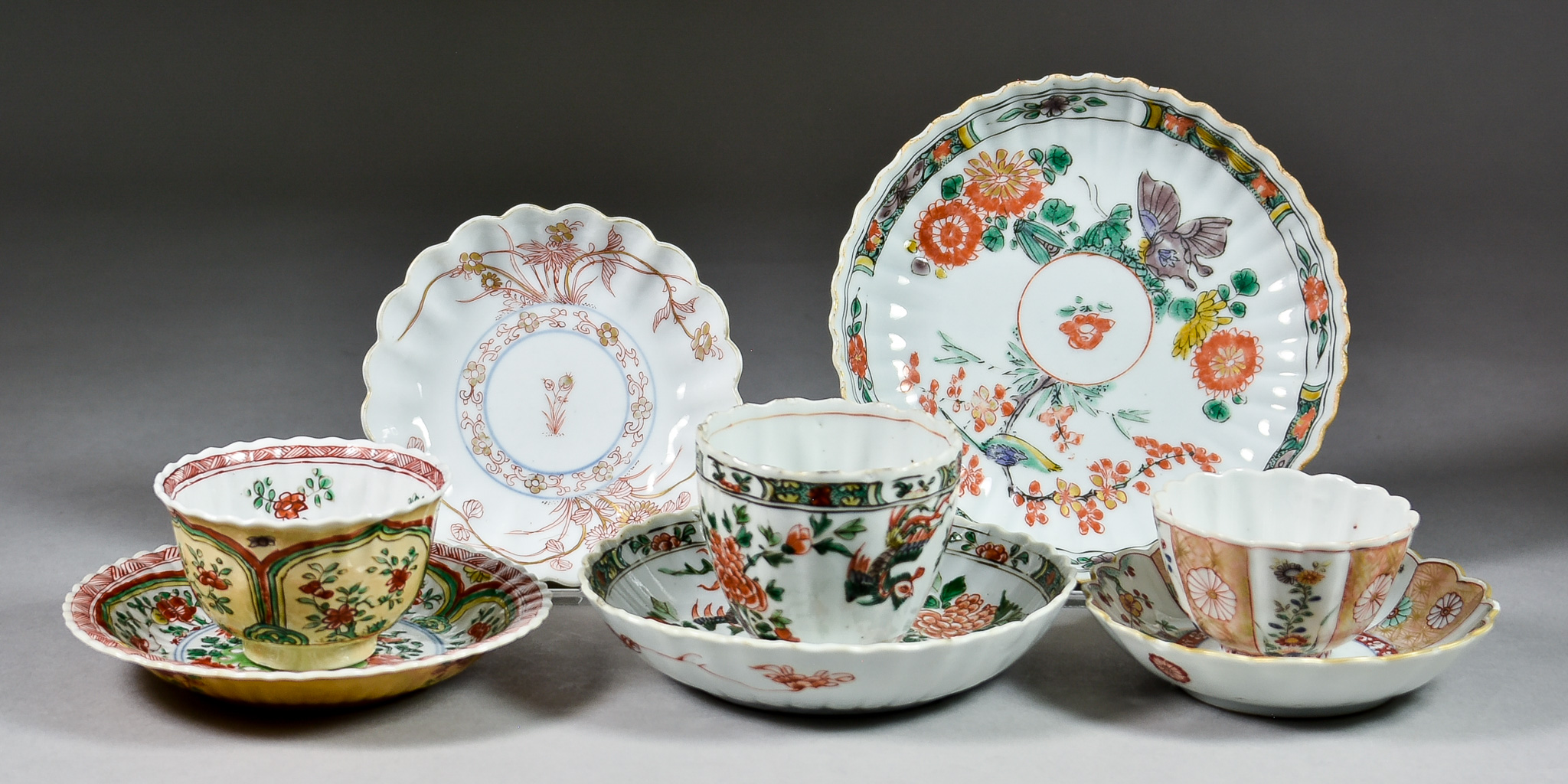 A Chinese Famille Verte and Cafe au Lait Porcelain Tea Bowl and Saucer, Kangxi Period, decorated