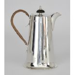 A George V Silver Hot Water Jug by Walker & Hall, Sheffield 1922, of tapered form, with ebonised