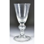A Massive Heavy Baluster Stemmed Wine Glass, with double knop stem with tier over a wide conical
