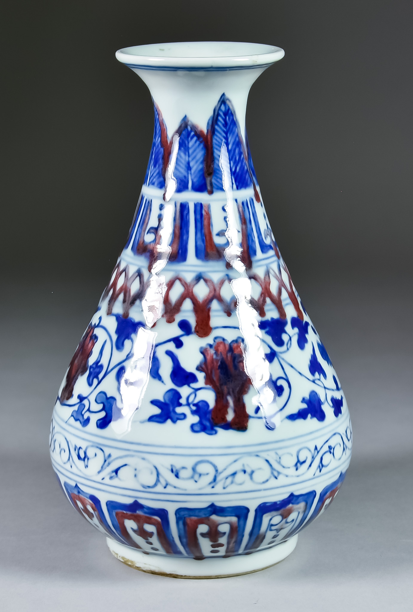 A Chinese Porcelain Blue and White Vase, painted with a running leaf design within bands, the