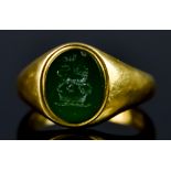 An 18ct Gold Signet Ring, 20th Century, set with green stone, carved with armorial lion on crown