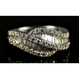 An 18ct Gold Diamond Ring, Modern, set with baguette and small brilliant cut white diamonds,