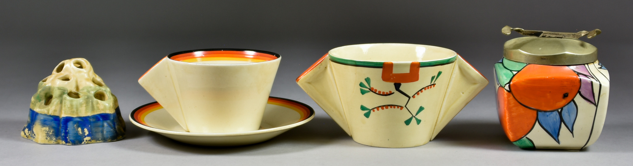 A Selection of Clarice Cliff Ceramics, comprising - a conical cup and saucer decorated in bands of