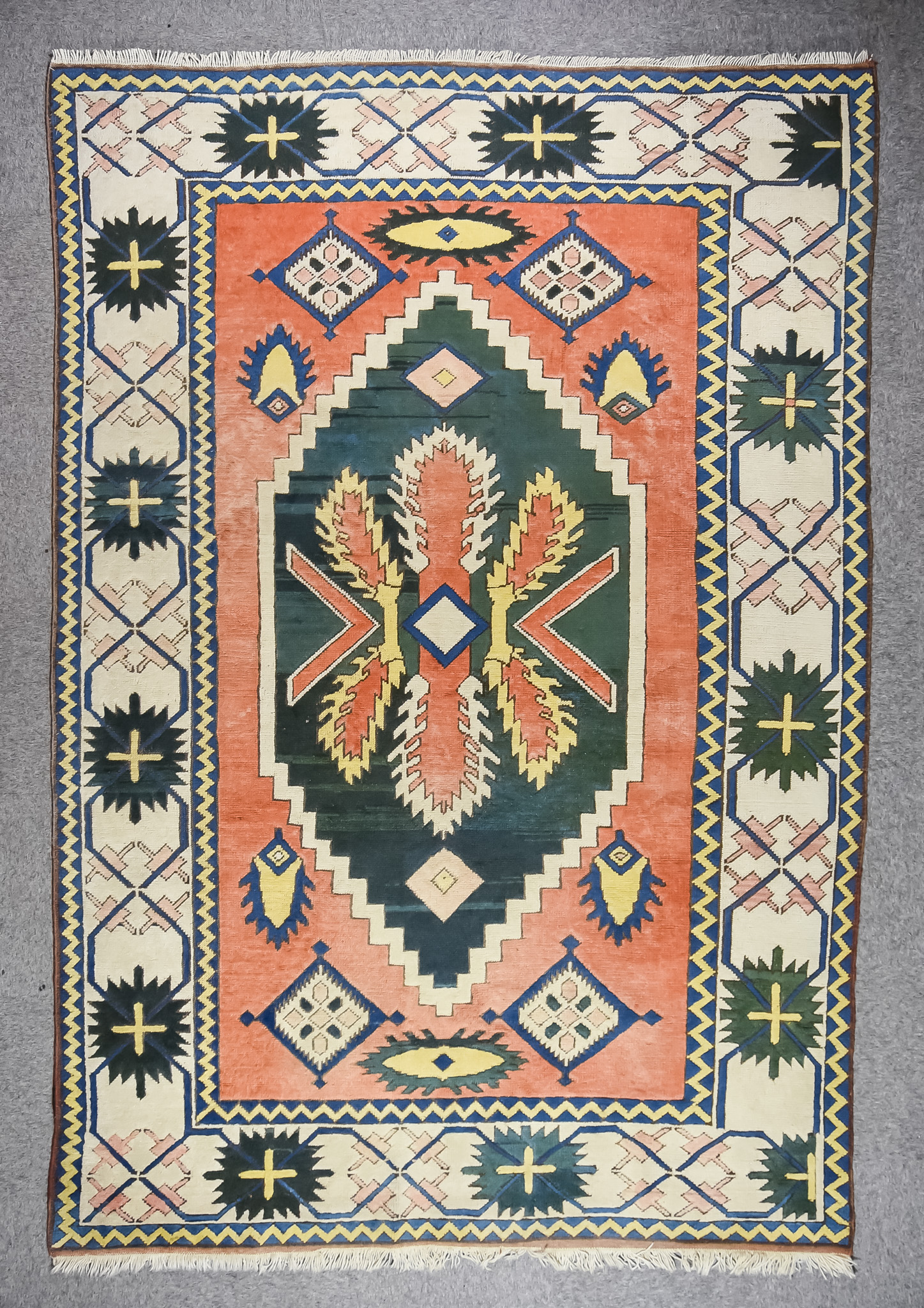 A 20th Century Anatolian Carpet of "Kazak" Design, woven in colours, with a central stepped