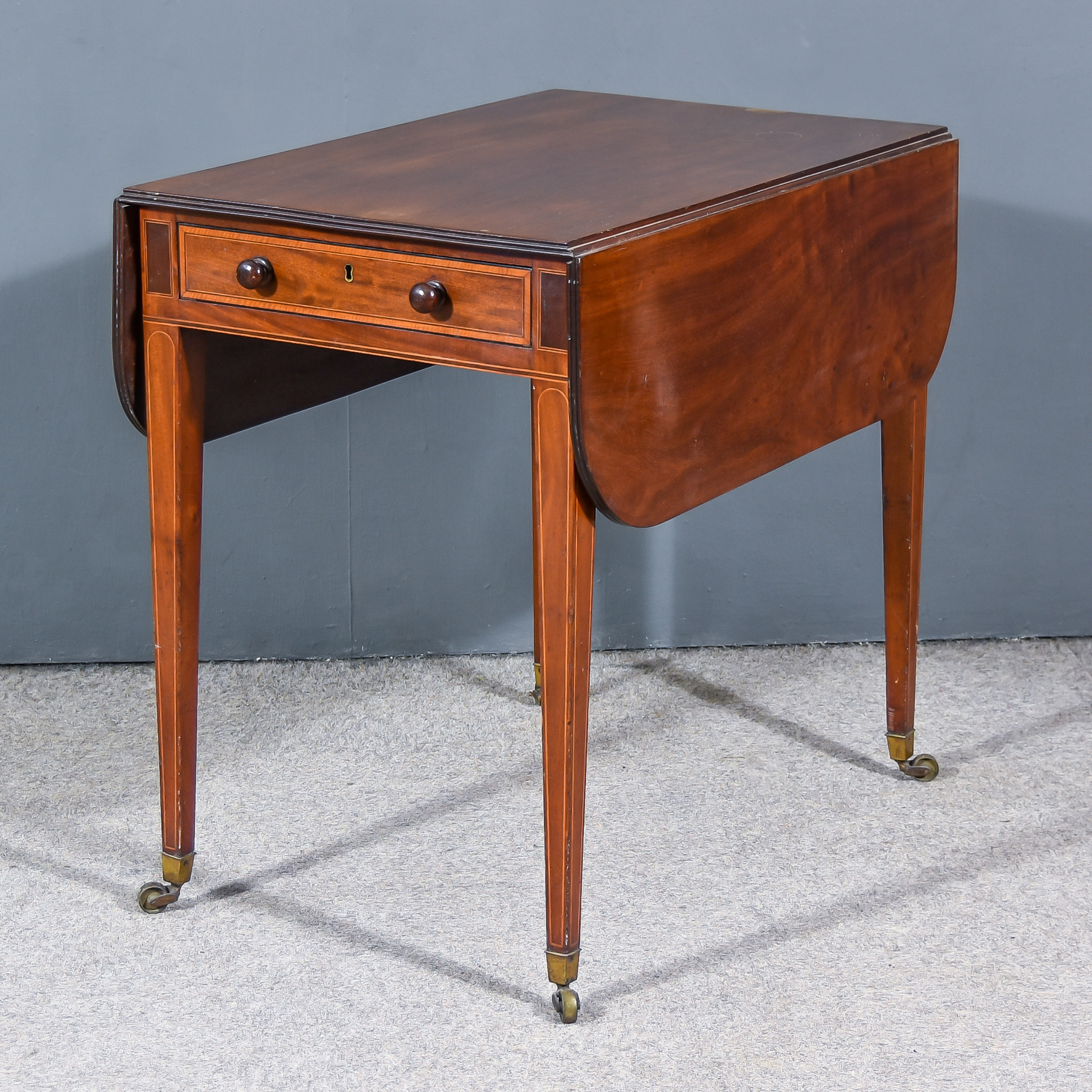 A George III Mahogany Pembroke Table, with triple reeded edge to top, fitted one real and one