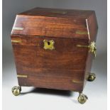 A Mahogany and Brass-Bound Sarcophagus-Shaped Decanter Box, 19th Century, the lid with plaque