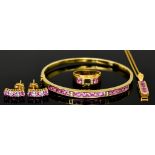 An 18ct Gold Pink Sapphire Suite, Modern, comprising - pendant on chain, earrings, bangle and