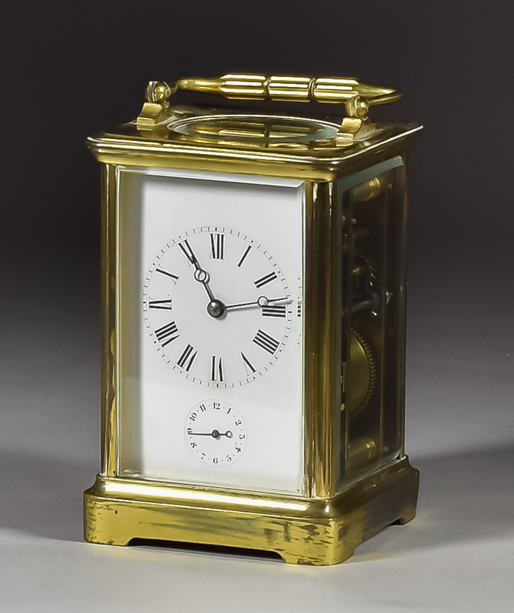 A Late 19th Century French Carriage Clock retailed by Boxell of Brighton, the white enamel dial with