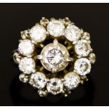 An 18ct White Gold Diamond "Halo"Ring, 20th Century, set with a centre brilliant cut white