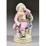 A Meissen Porcelain Figure of a Child, 19th Century, seated and tied to a chair, crying, a book open