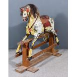 An Early 20th Century Black and White Dappled Rocking Horse, in the manner of Collinson, square pine