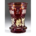 A Bohemian Red Flashed Beaker, 1850, engraved with named neo-classical buildings and dated 1850,