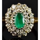 An 18ct Gold Emerald and Diamond Cluster Ring, 20th Century, set with a central emerald stone,