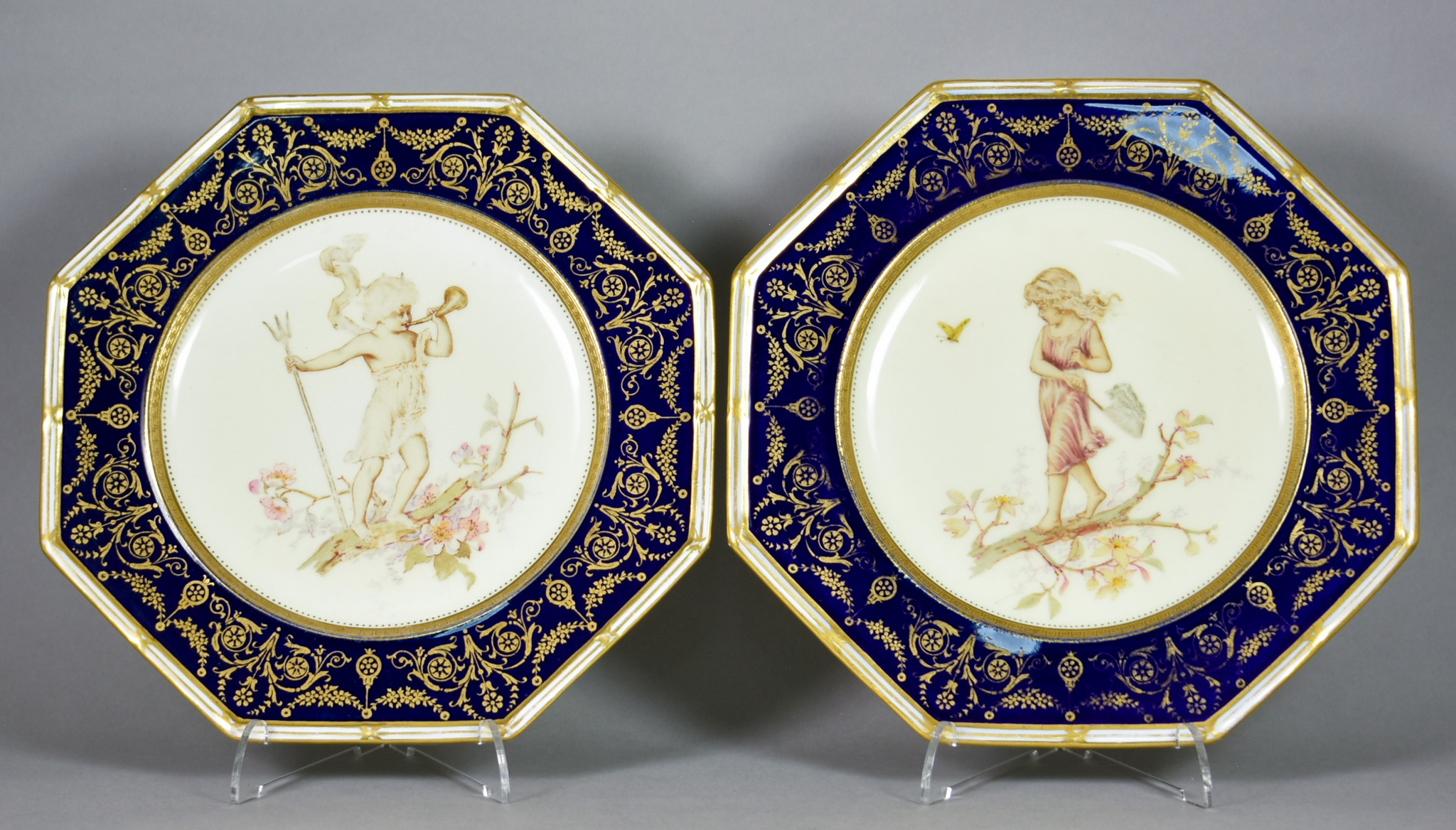 A Pair of Wedgwood Porcelain Octagonal Plates, with white, blue and gilt borders, the centres